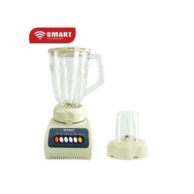 1 (13) Cream-colored blender with a tall glass pitcher and a separate small jar on the side, branded Smart Technology graphic visible above the setup.