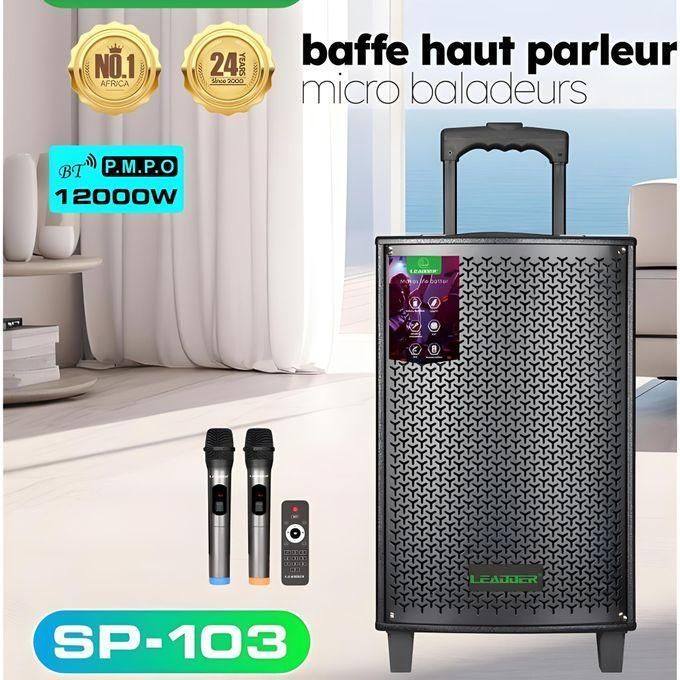 1 (5) Portable speaker system on wheels with two wireless microphones and a remote, labeled SP-103, displayed in a bright living room.