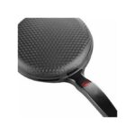 Close-up of a round grill pan with a textured, dimpled cooking surface and a black handle.