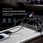 Car center console charging two devices at full speed: Type-C up to 36W and USB-A up to 33W (total 69W) with cables plugged in.