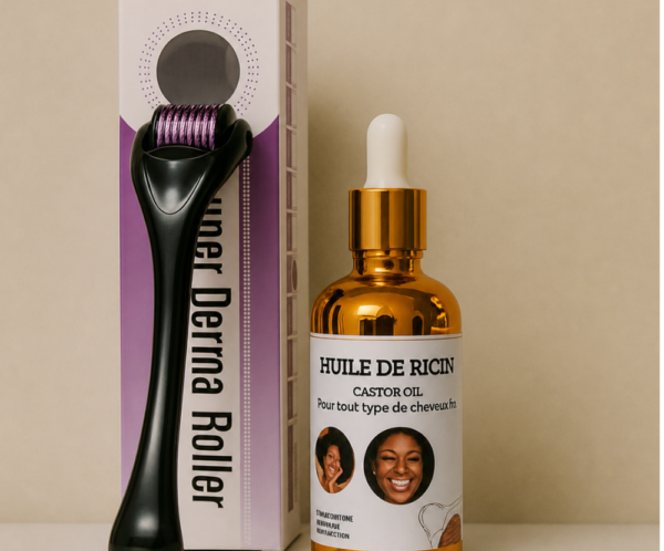 Gold castor oil bottle with dropper beside a boxed derma roller on a beige surface.