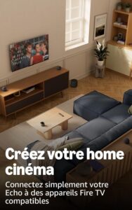 Living room with a wall-mounted TV, wooden media console, blue sofa, and a plant; large white French ad text promoting a home cinema with Echo and Fire TV.
