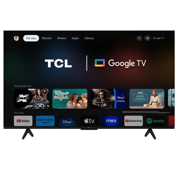 1 TCL TV displaying Google TV home screen with app row and logos on a dark background inside a living room setup