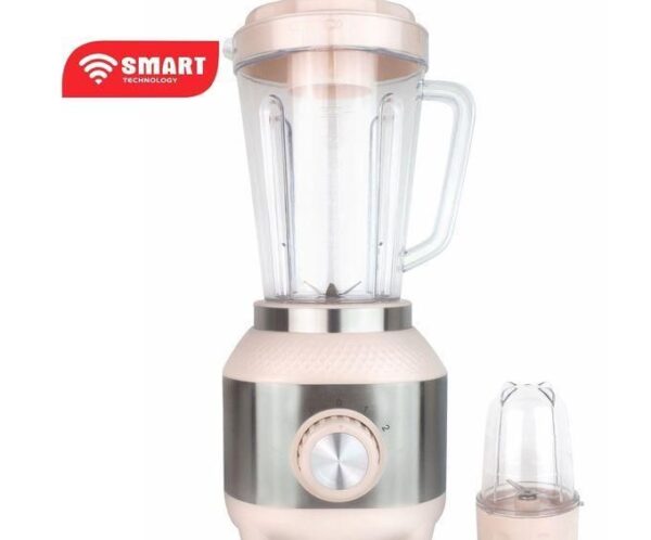 Pink and satin‑silver countertop blender with glass pitcher and a separate small grinding jar, featuring a circular dial and two speed settings, labeled 'Smart Technology' badge on the top left.