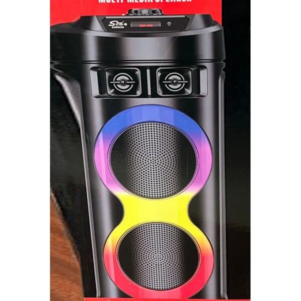 Black portable speaker with two round driver grilles and a rainbow-colored ring around them.