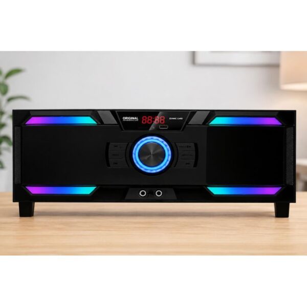Black home audio speaker with a glowing blue circular dial and multicolor LED accents on a wooden table.