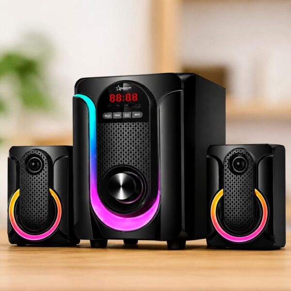 Black multimedia speaker system with a central subwoofer and two satellite speakers, each with colorful RGB ring lighting on a wooden table.