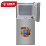 Two‑door SMART Technology refrigerator with the upper freezer open and a colorful fruit label on the lower door