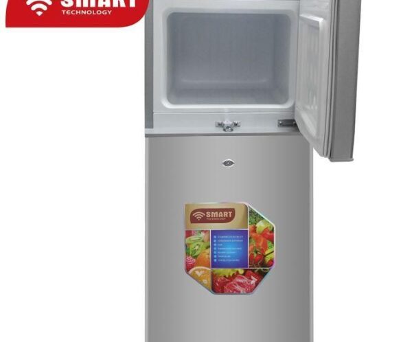 Two‑door SMART Technology refrigerator with the upper freezer open and a colorful fruit label on the lower door