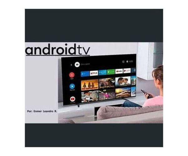 Person lounging on a sofa using a remote to navigate an Android TV interface on a wall-mounted TV.