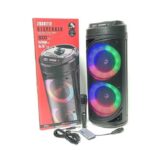 Portable Bluetooth speaker with rainbow LED ring lights, shown beside its box, remote, and power cable.
