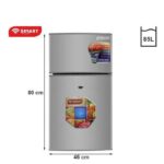 Silver two-door SMART refrigerator with top freezer, dimensions 80 cm tall by 46 cm wide and 85 L capacity, with fruit stickers on door.