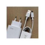 White 33W USB charger with European plug and a USB-A/USB-C cable on a cardboard background, ready to charge a device.