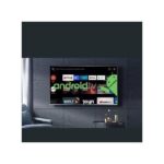 Wall-mounted flat-screen TV displaying the Android TV interface with the Android mascot on the screen.