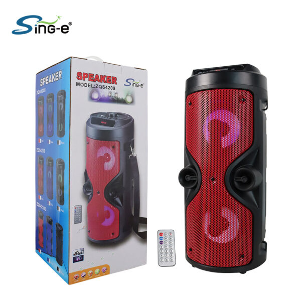 Portable red and black Bluetooth party speaker with LED ring lights, shown with remote and its packaging box